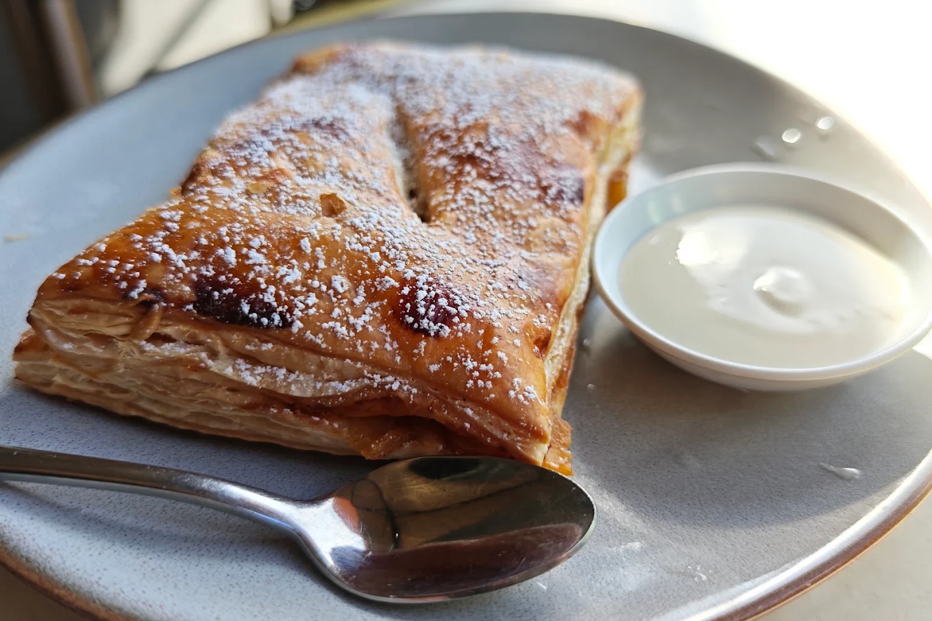 Vanilla slice plated with cream
