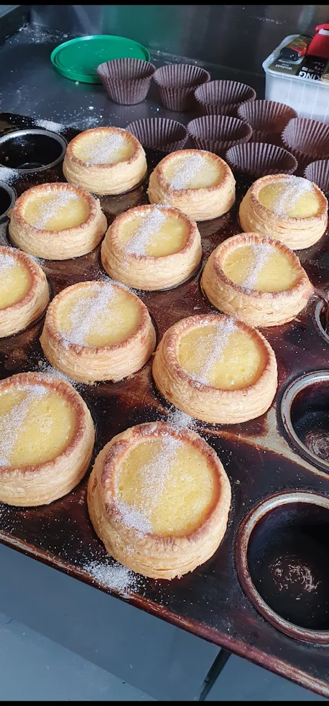 Tray of custard tarts fresh from the oven