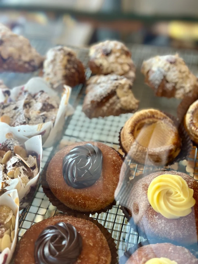 Cream-filled buns on a baking tray