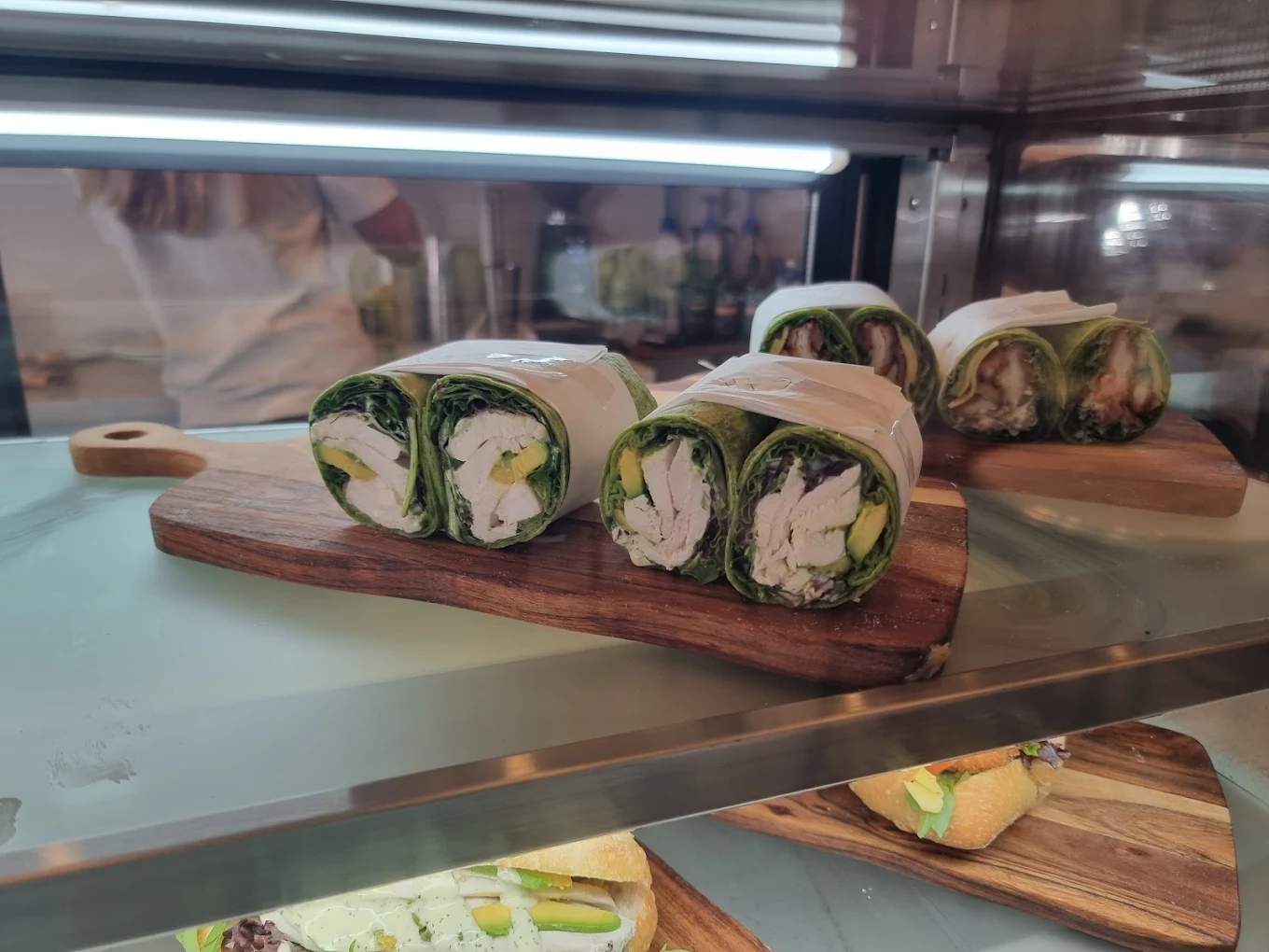 Fresh wraps on a timber board in the cabinet